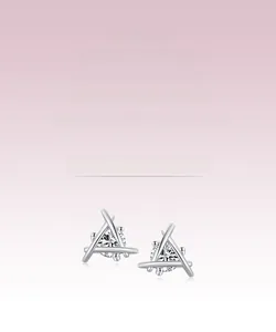 Macro shot of silver geometric triangle stud earrings with sparkling round cubic zirconia