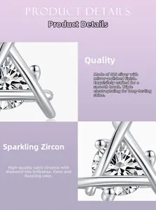 Macro detail of geometric S925 sterling silver studs with polished zirconia inlay