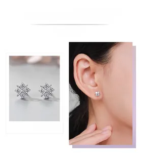 Macro shot of S925 silver four-leaf clover earrings with brilliant zircon stones
