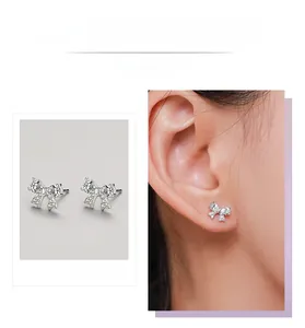 Detailed view of S925 sterling silver bow earrings featuring shimmering zircon stones