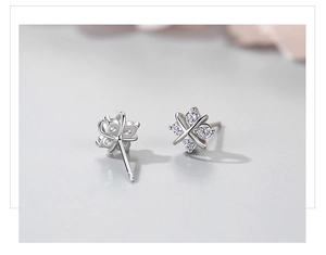 Detail of S925 sterling silver four-leaf clover stud earrings with clear zircon stones