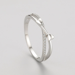 Elegant S925 silver crossover ring with interlocking hearts and shimmering pave crystals