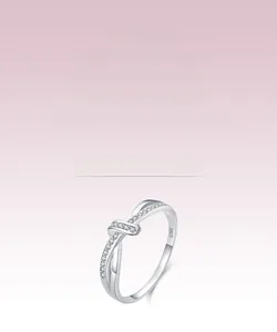Close-up of S925 sterling silver knotted ring with pavé cubic zirconia setting