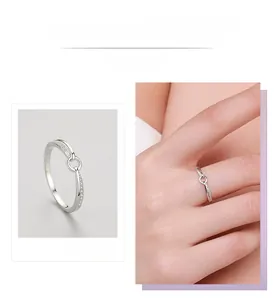 Detail of S925 sterling silver ring featuring interlocking loops with pavé set zircon stones