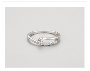 Macro detail of S925 sterling silver ring featuring crisscross design with micro pavé stones