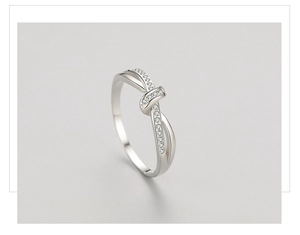Macro shot of s925 silver double-layer knot ring with pave cubic zirconia accents