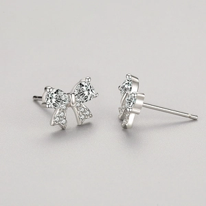Elegant S925 sterling silver bow stud earrings featuring sparkling drop-shaped zirconias