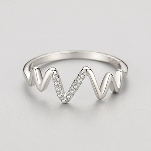 Minimalist S925 sterling silver wave ring featuring micro-pave cubic zirconia accents