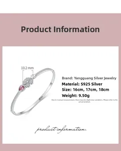 Detail of S925 sterling silver four-leaf clover bangle with pink teardrop gemstone