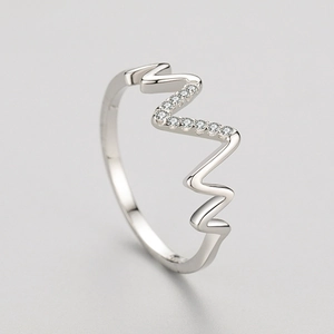 Polished S925 sterling silver wave ring with minimalist micro-pave crystals on top view