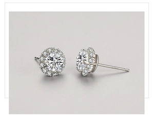 Macro detail of classic S925 silver round halo stud earrings with brilliant zircon stones