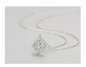 Macro shot of S925 sterling silver geometric rhombus pendant with sparkling zircon stones