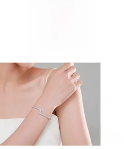 Close-up of S925 sterling silver lightning bolt bracelet with shimmering pave diamonds