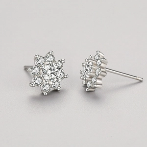 S925 sterling silver snowflake earrings with cubic zirconia stones in macro view
