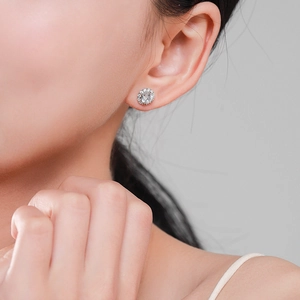 Classic S925 sterling silver halo stud earrings with brilliant cubic zirconia on model