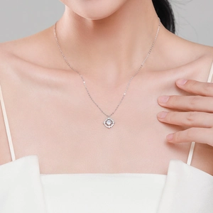 S925 sterling silver necklace with a sparkling diamond geometric pendant on a model