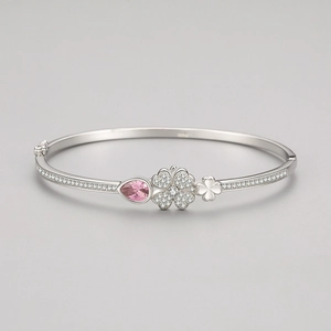 S925 sterling silver clover bangle featuring pink pear-cut stone and pavé crystal charms
