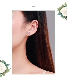 Close-up of S925 silver crescent moon and star stud earrings worn by a model