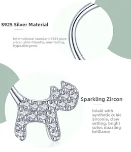 Macro detail of S925 sterling silver kitten earrings with cubic zirconia claw setting