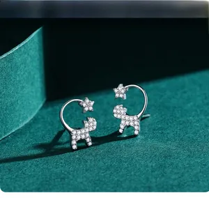 Detailed view of S925 sterling silver kitten and star stud earrings with zircon pavé setting