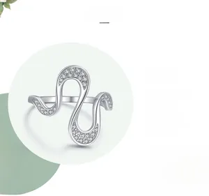 Detail of S925 sterling silver geometric ring with sparkling zircons and triple polishing