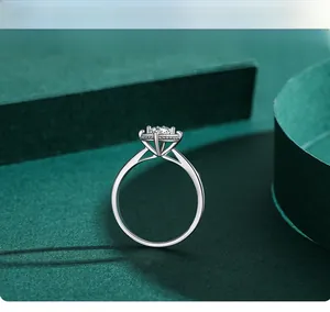Macro detail of a square-cut diamond ring in silver four-prong halo setting