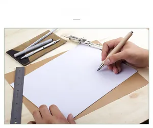 Close-up of artist hand using a professional wooden drawing pen on sketch paper