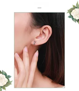 Close-up of creative s925 silver scissor stud earring worn on model for a minimalist look