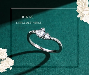 Detail of S925 silver ring featuring double heart-shaped stones and pavé set diamonds