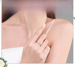 Detail of s925 silver ring featuring a round solitaire stone with twisted pave band