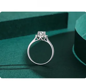 Macro view of s925 sterling silver ring featuring a round diamond in a floral halo setting