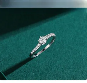 Close-up of a classic six-prong s925 silver engagement ring with side-set diamonds