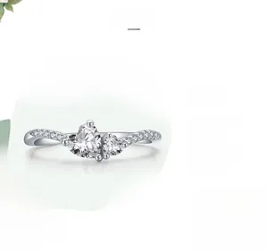 Macro shot of s925 silver ring featuring heart-shaped zircon stones and polished finish