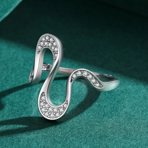 Elegant S925 sterling silver wavy ring with shimmering pavé diamonds on a dark background