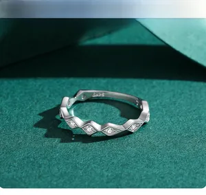 Macro view showing the S925 hallmark and zircon micro-pave on geometric silver ring