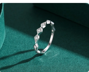 Macro view of S925 sterling silver geometric rhombic ring with micro-pave cubic zirconia