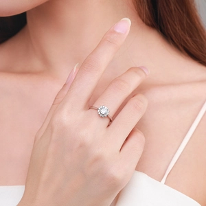 Exquisite S925 sterling silver flower ring with round cut center stone on female model