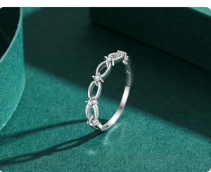 Macro shot of S925 sterling silver chain ring with hollow stars and micro-pave zircons