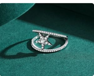 Macro shot of double-layered S925 silver star ring with micro-paved sparkling crystals