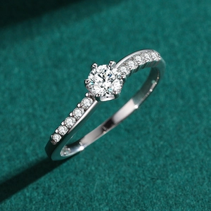 Elegant S925 silver six-prong diamond ring featuring a sparkling round center stone and pave band