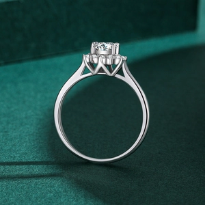 S925 sterling silver halo diamond ring featuring a crown-shaped prong setting on a green stand