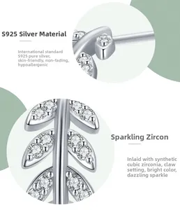 Macro detail of leaf-shaped S925 sterling silver earring with cubic zirconia inlay