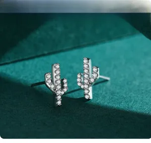 Macro view of S925 sterling silver cactus stud earrings with micro paved zircons