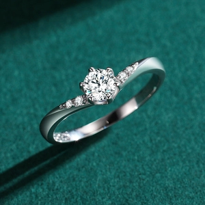 Elegant S925 sterling silver six-prong diamond ring with twisted band on green velvet