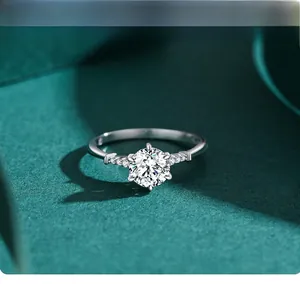 Macro detail of a 925 sterling silver ring featuring a six-prong round cut diamond solitaire