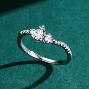 Elegant S925 silver double heart-shaped diamond ring on green velvet background