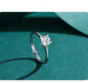 Detailed view of a classic four-prong silver ring with a brilliant round solitaire diamond