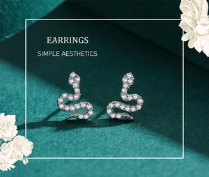 Macro shot of S925 sterling silver snake earrings with pavé white zircon stones