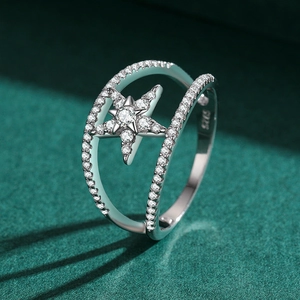 S925 sterling silver star ring with double line pavé setting on green background