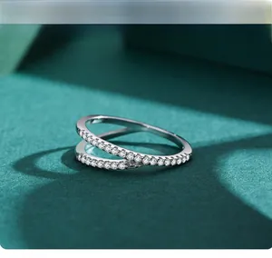 Detailed close-up of a s925 silver double-layer crisscross ring with micro-pave zircons